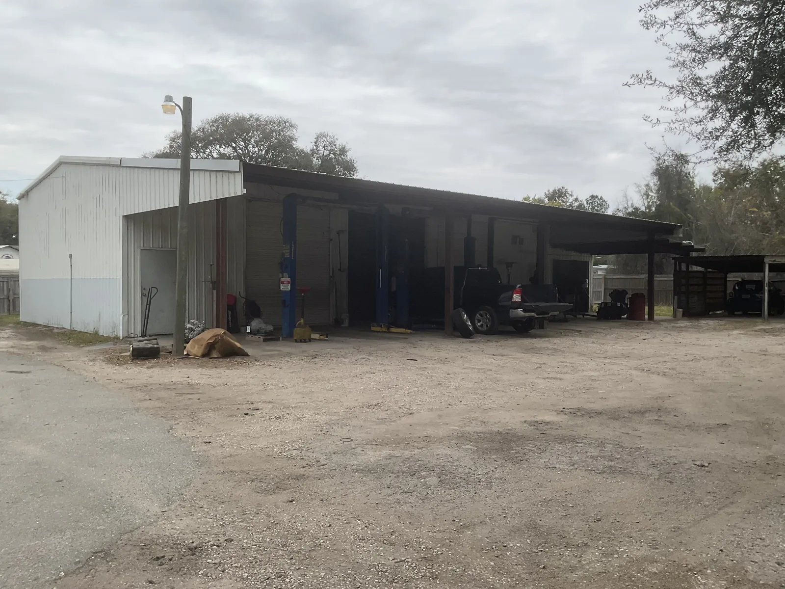Wide view of the Leesburg estate buildings and fenced acreage